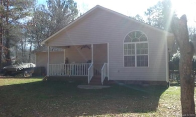 Covered rear porch just off of master bedroom