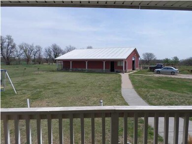 4 STALL HORSE BARN WITH CEMENT FLOOR, TACK ROOM AN