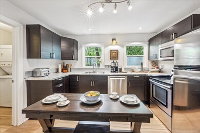 Kitchen with stainless steel appliances, light co
