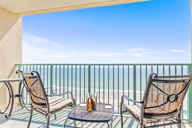 Balcony with a water view and a beach view