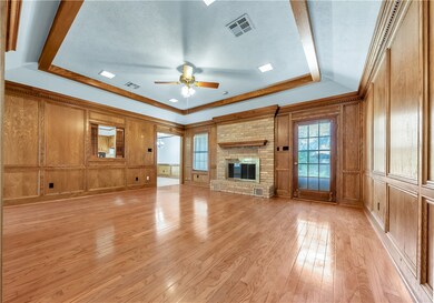 Unfurnished living room with a decorative wall, a