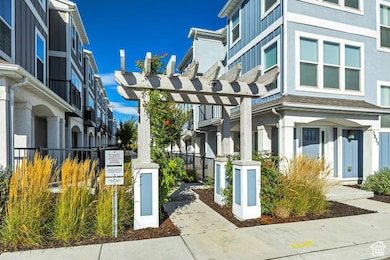 View of property's community with a pergola and a residential view