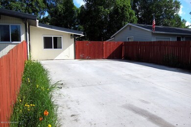 Double wide driveway, Gate to back yard