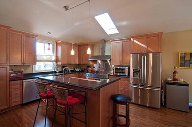 Check out this gourmet kitchen! Deep cabinets, pot and pan drawers, custom lighting, separate island, built-in pantry, Bosch dishwasher, two sinks and beautiful floors. Nothing to want here! 