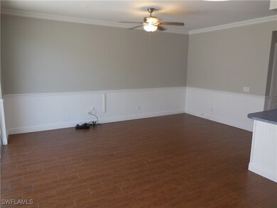 Spare room featuring dark hardwood / wood-style fl