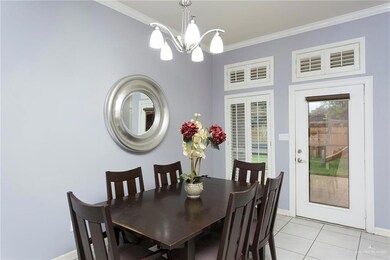 Dining area with pretty windows and outside access to the covered patio and outside restroom.