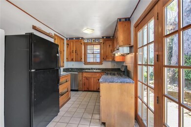 The kitchen with refrigerator, gas range/oven, and