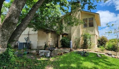 Rear view of house with cooling unit