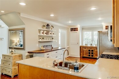 Enlarged kitchen with custom shelving, cabinets, w