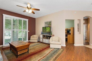 A set of sliders in the living room offers up a be