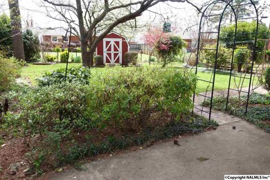 Shady back yard.  Nice garden area.