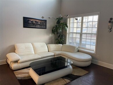 Living room with plenty of natural light and wood finished floors