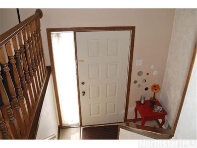 Foyer open to the living room. Very inviting, with