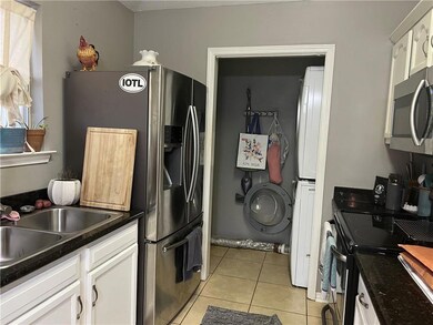 Kitchen with view of laundry/pantry