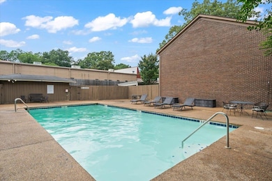 Community pool with a patio area