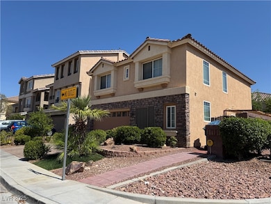 View of front of house featuring stucco siding, st