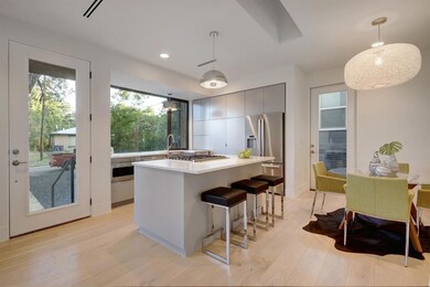 Kitchen featuring appliances with stainless steel