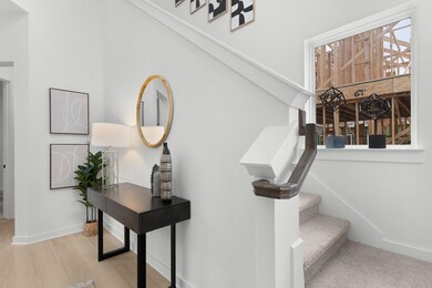 Stairs with wood finished floors and baseboards