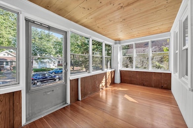 Warm wood accents give the porch a cozy vibe.