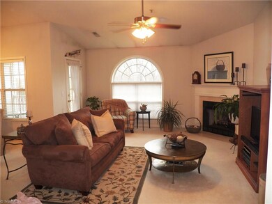 Spacious living room with fireplace and built ins is a great place to entertain guests or just relax with a book.