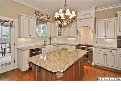 Kitchen features include custom cabinetry, large i