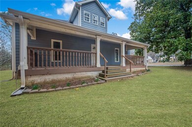 View of front of house featuring a porch and a fro
