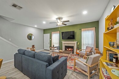 Living room adorned with a wood burning fireplace