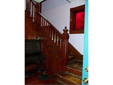 Entry/Foyer. Entry hall with detailed wooden stair