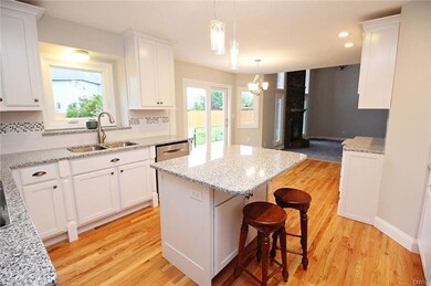 THE KITCHEN FLOWS THROUGH TO THE FAMILY ROOM