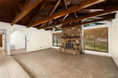 Sunken living room featuring Timeless Exposed Wood beams & Cozy Fireplace