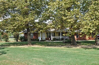 Mature trees fill the front yard provided shade & 