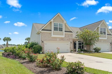 View of front of house featuring a garage and a fr