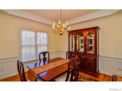 Gorgeous Dining Area features Tray Ceiling, Wainsc