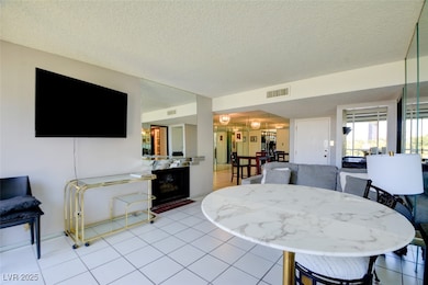 Dining area with light tile patterned flooring, vi