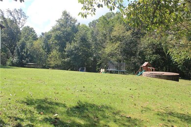 Fun yard. Cement cistern in view on right.