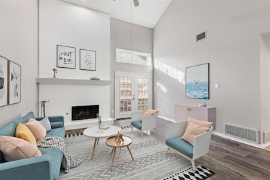 Living room with ceiling fan, hardwood / wood-styl