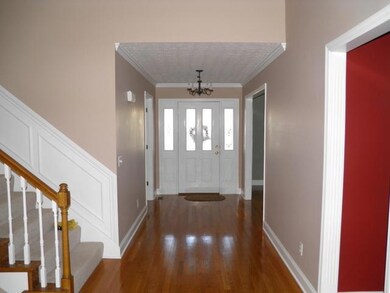 Lovely, welcoming foyer with hardwood flooring.