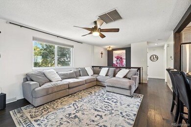 The living room is flooded with light from the south facing picture window.
