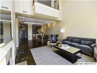 Living Room with a vaulted ceiling, fireplace and 