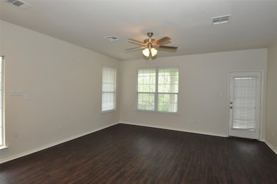 Spare room featuring dark wood-type flooring, cei