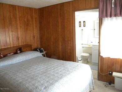 Master Bed toward bathroom