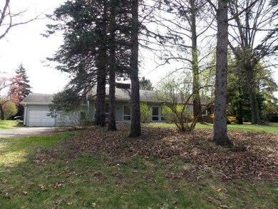 Exterior Back. Treed rear yard-2 car attached Gara