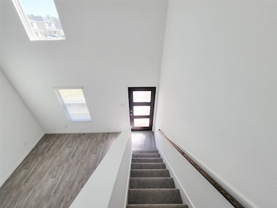 Bright and airy entryway with modern design, featu