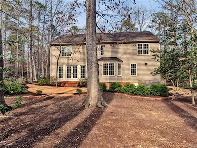 View of the landscaped backyard and lovingly-maintained home