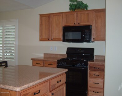 Kitchen - Gas Range and Hickory Cabinets