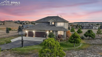 Traditional-style house featuring concrete driveway, stucco siding, a garage, a shingled roof, and a front yard