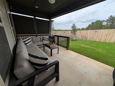 Fenced backyard with outdoor lounge area and a pa