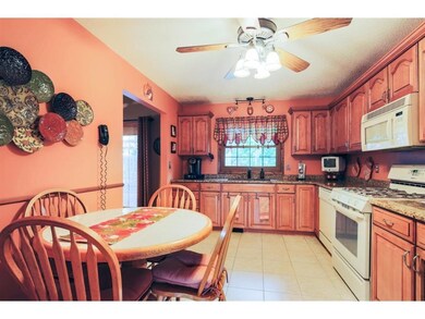 Eat in kitchen updated with new cabinetry, granite