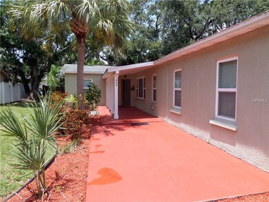 Front patio area leading to covered entry -- lush 