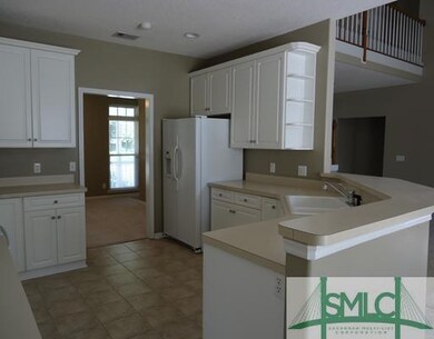 Kitchen. The spacious kitchen opens to the separat